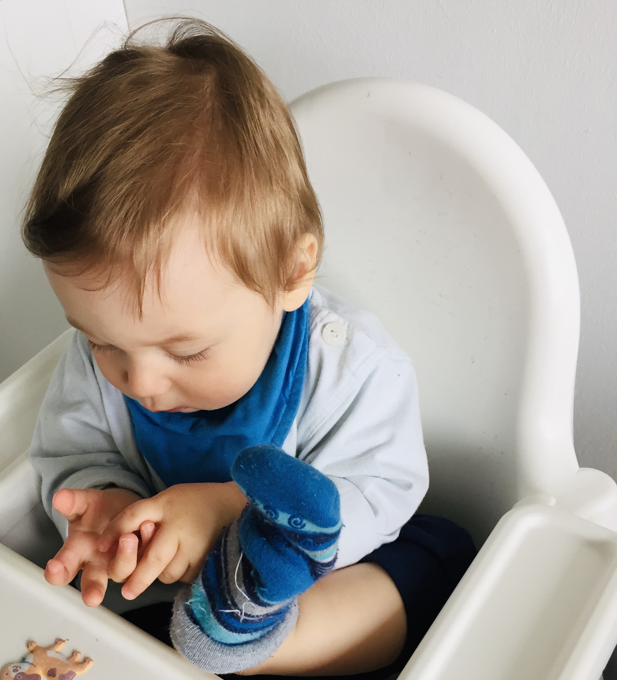 kid playing with a sock