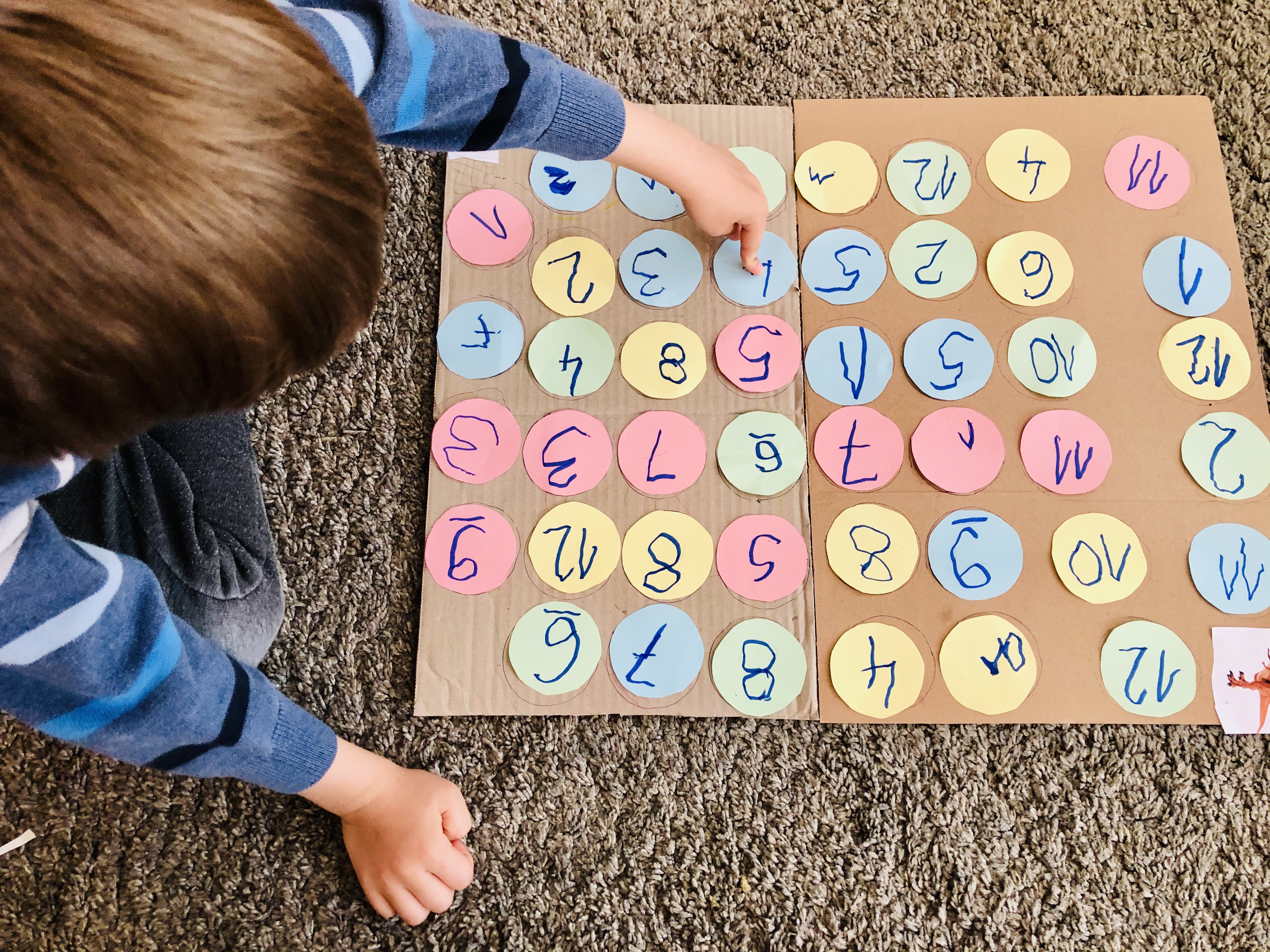 kid playing with numbers maze