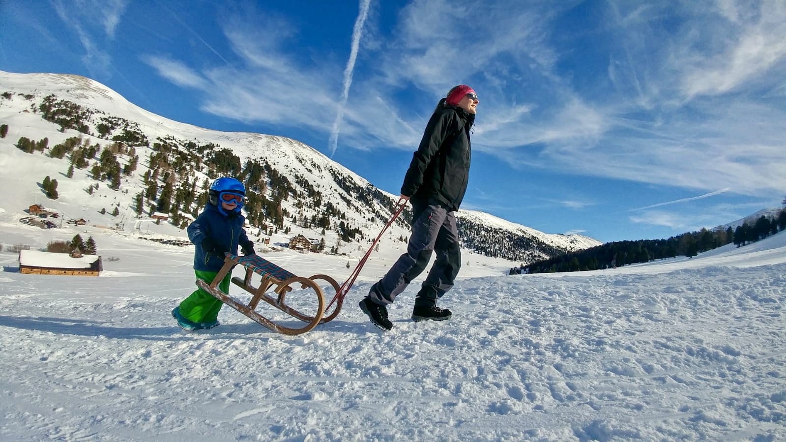 mum and kid pulling sledge