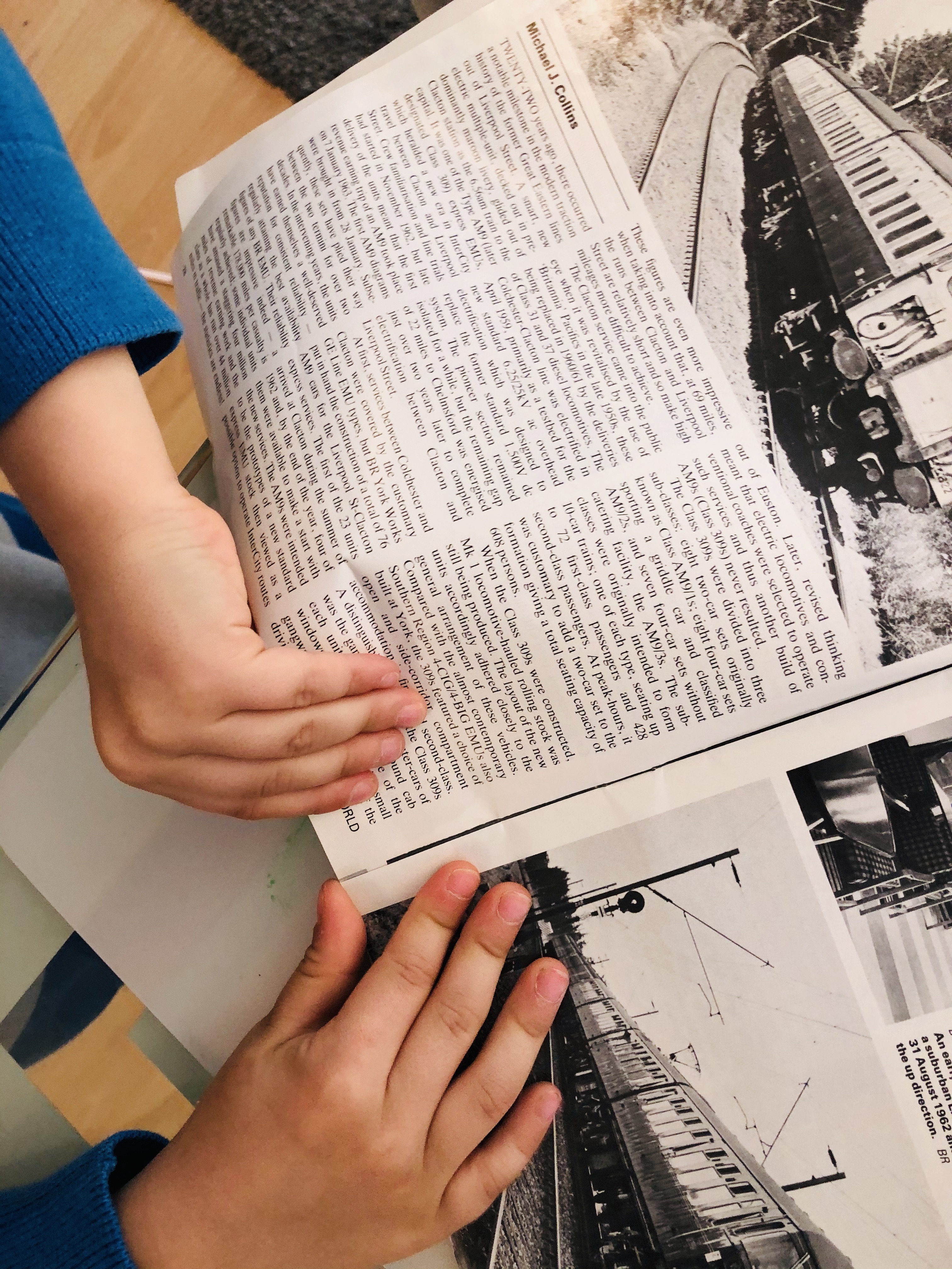 kid tearing out old magazine papers
