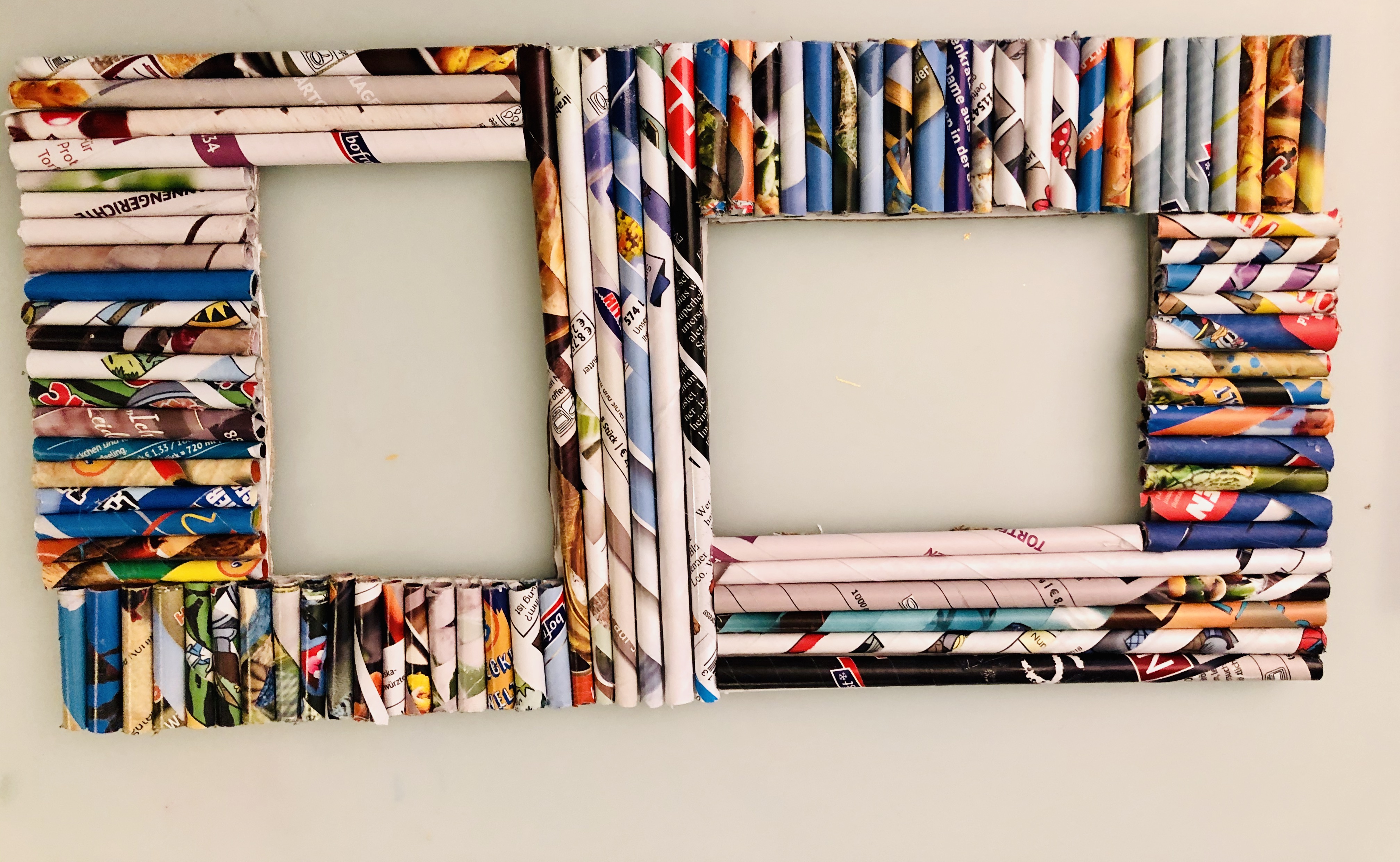 picture frame with magazine paper rolls in the same size