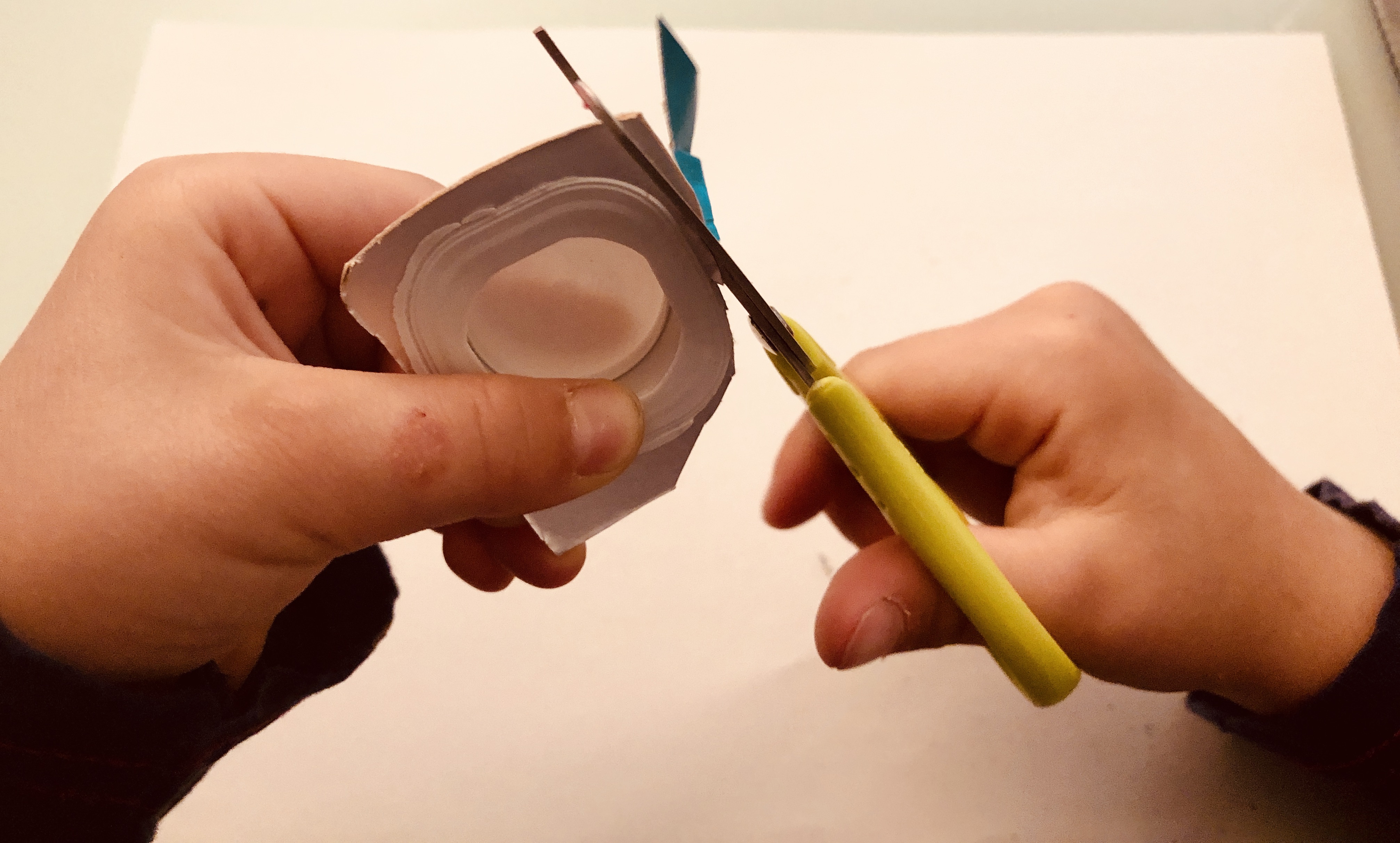 cutting milk carton lids