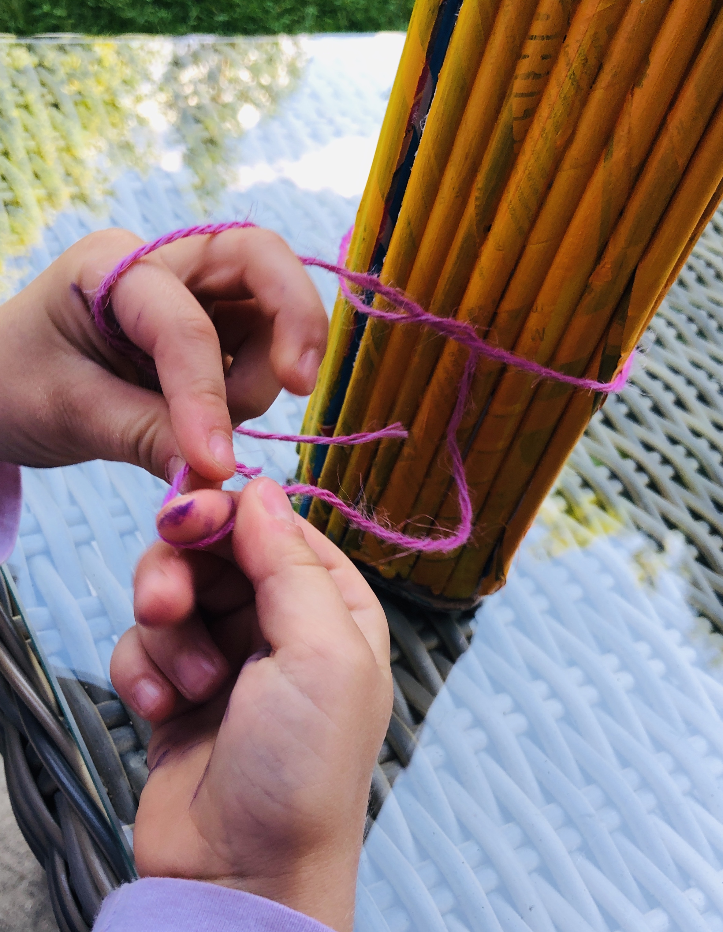 tying a yarn on a vase