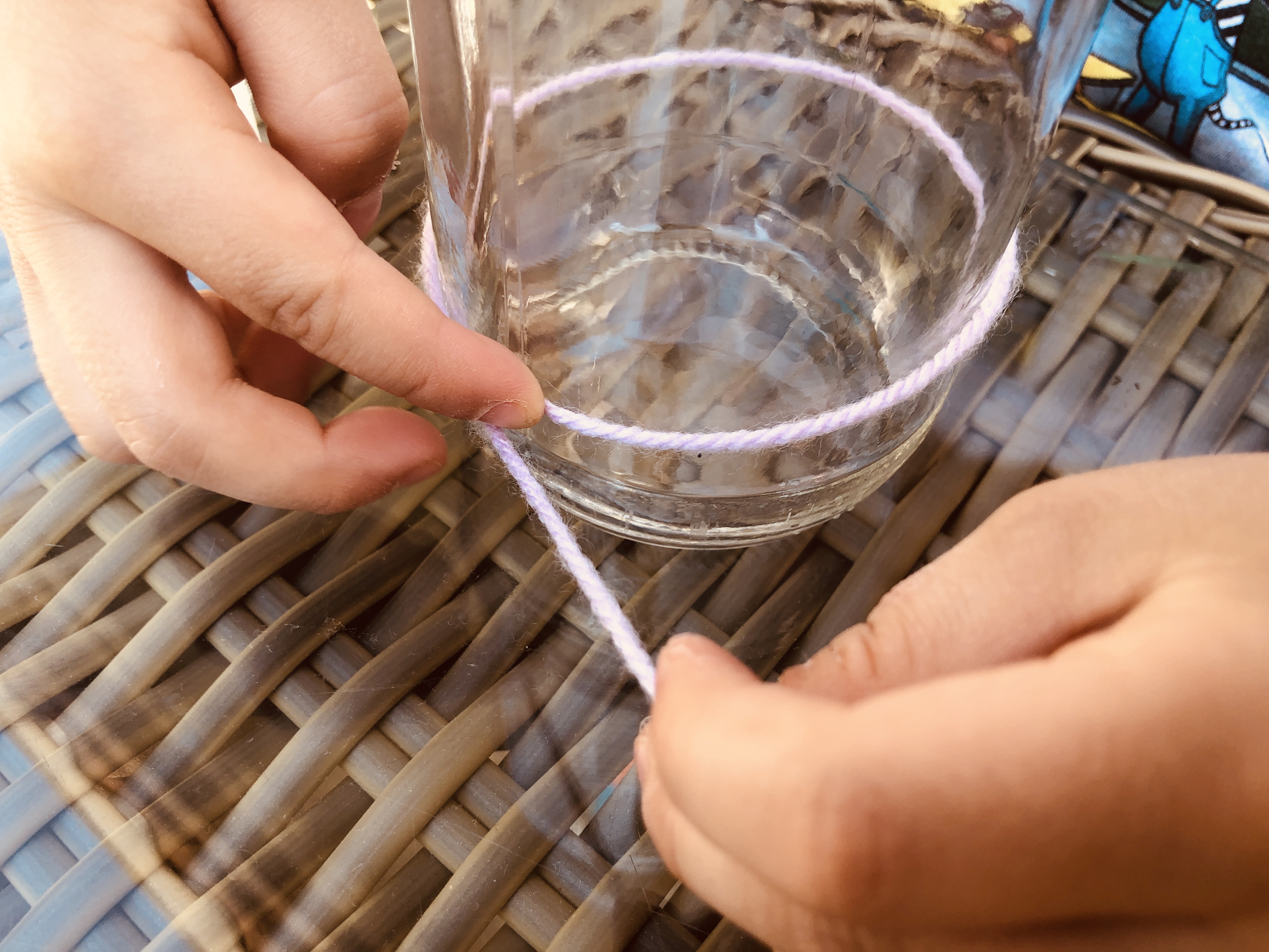 measuring the circumference of the bottle