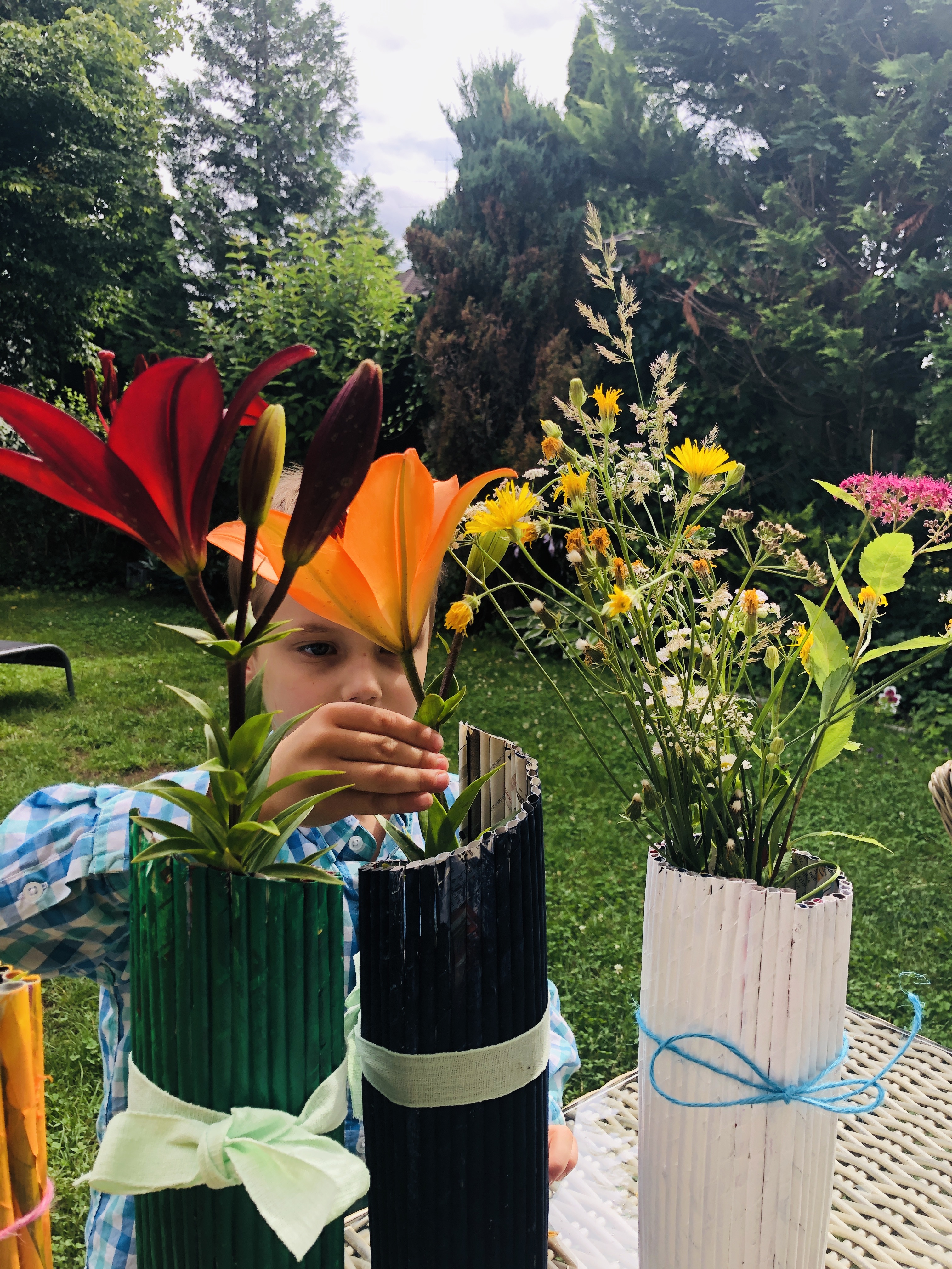 putting flowers in a vase