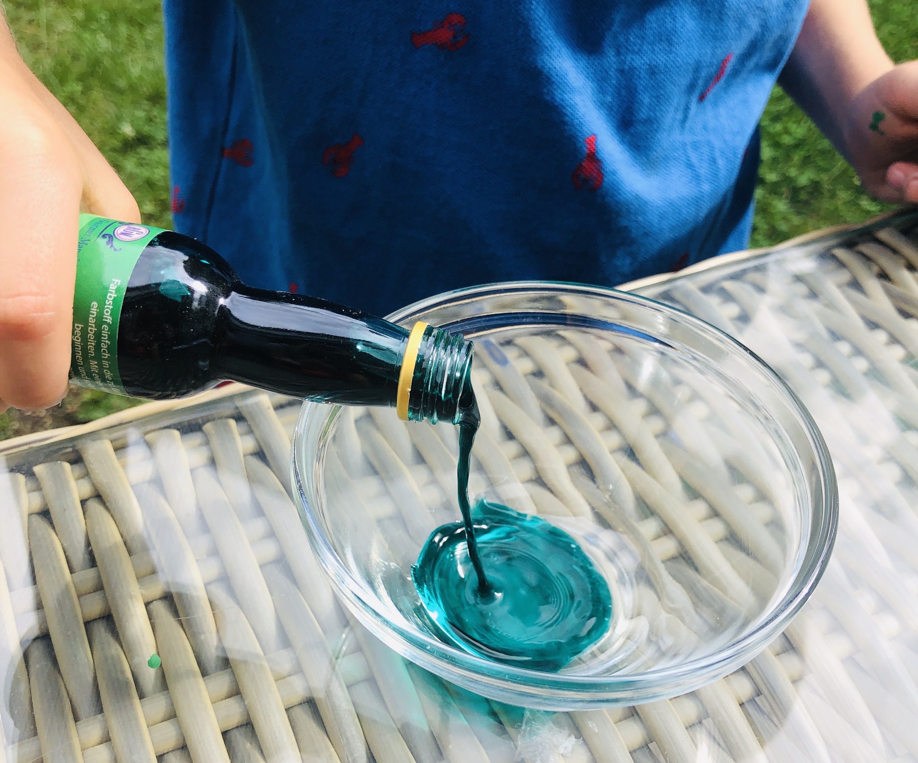 pouring food colour into a bowl