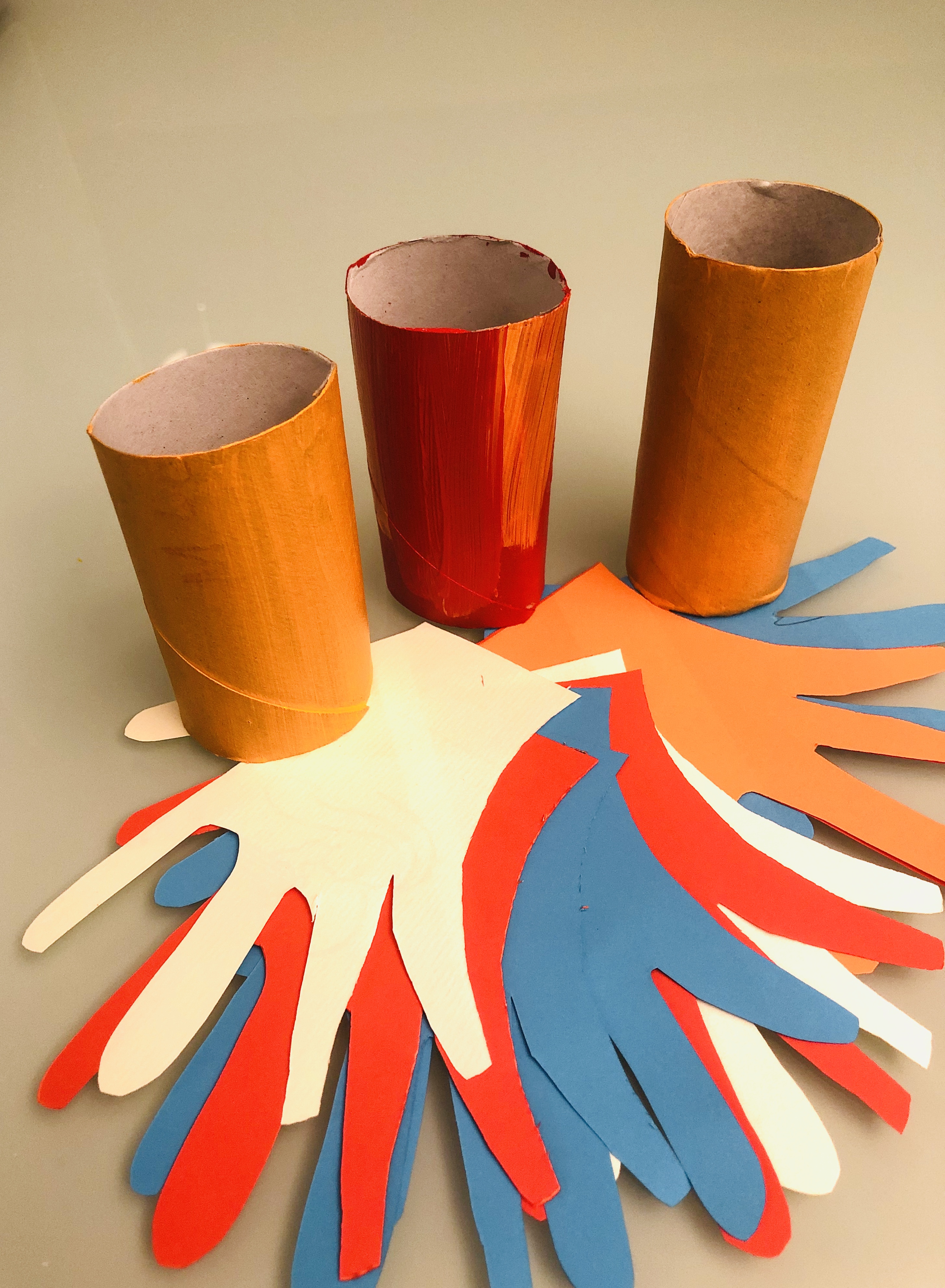 toilet paper rolls and hand cut-outs for the parrots 